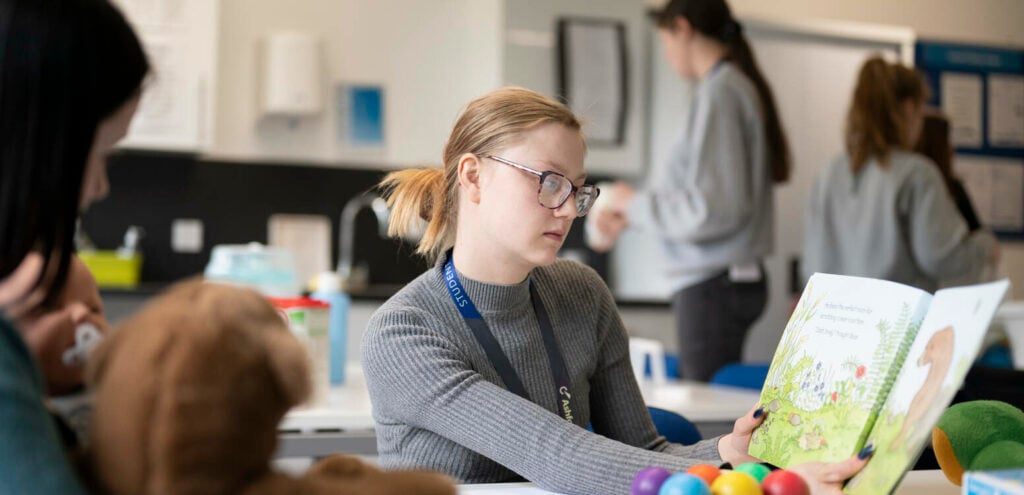 Early Years Student Reading Childrens Book
