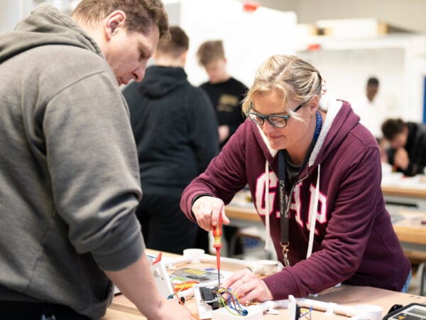 Electrical student working on plug sockets.