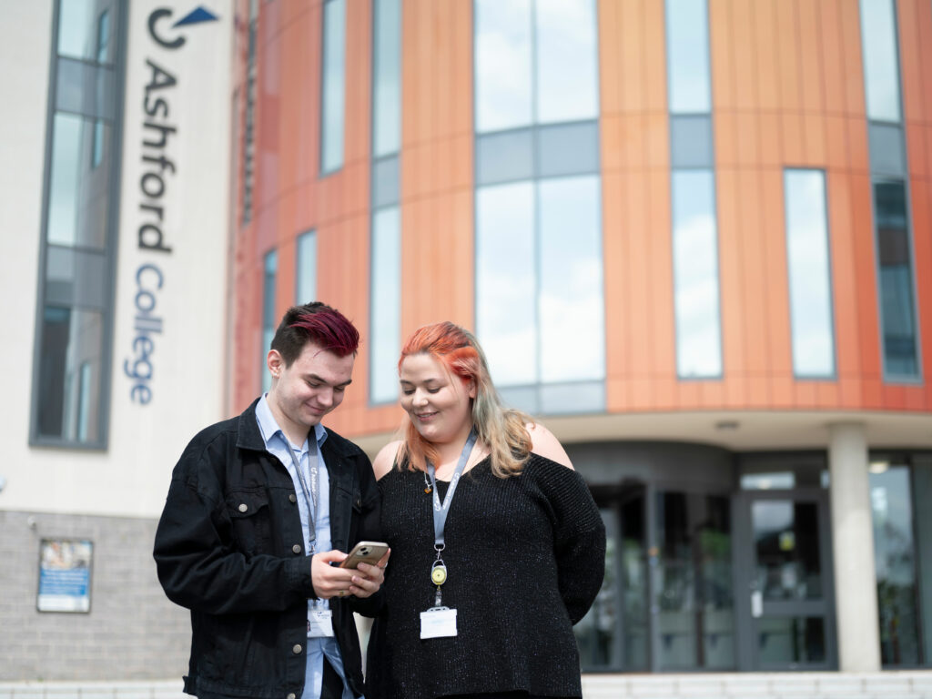 Students standing outside the main doors.