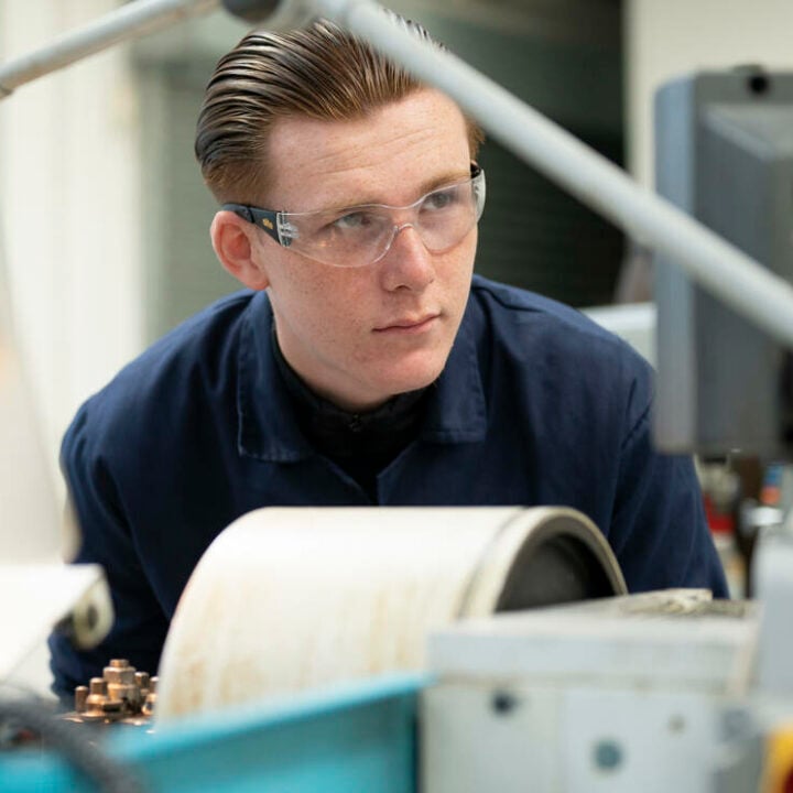 Engineering student using equipment