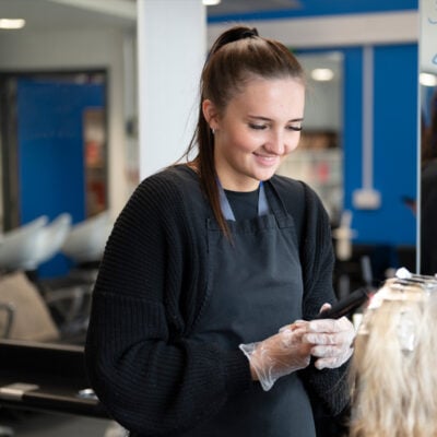 Hairdressing student working on a client