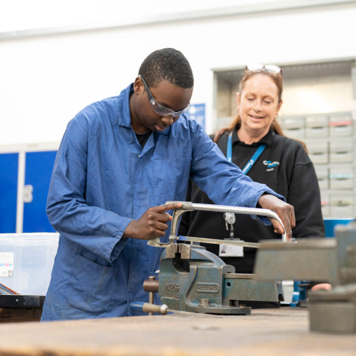 Engineering student using equipment