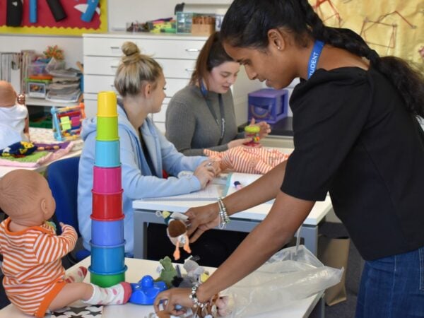 Early Years Student In Classroom working