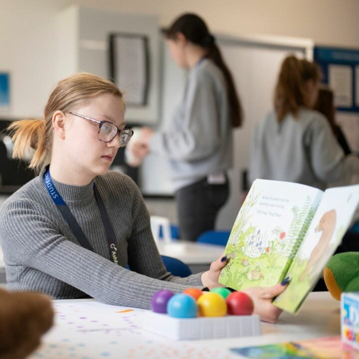 Early Years Student Reading Childrens Book