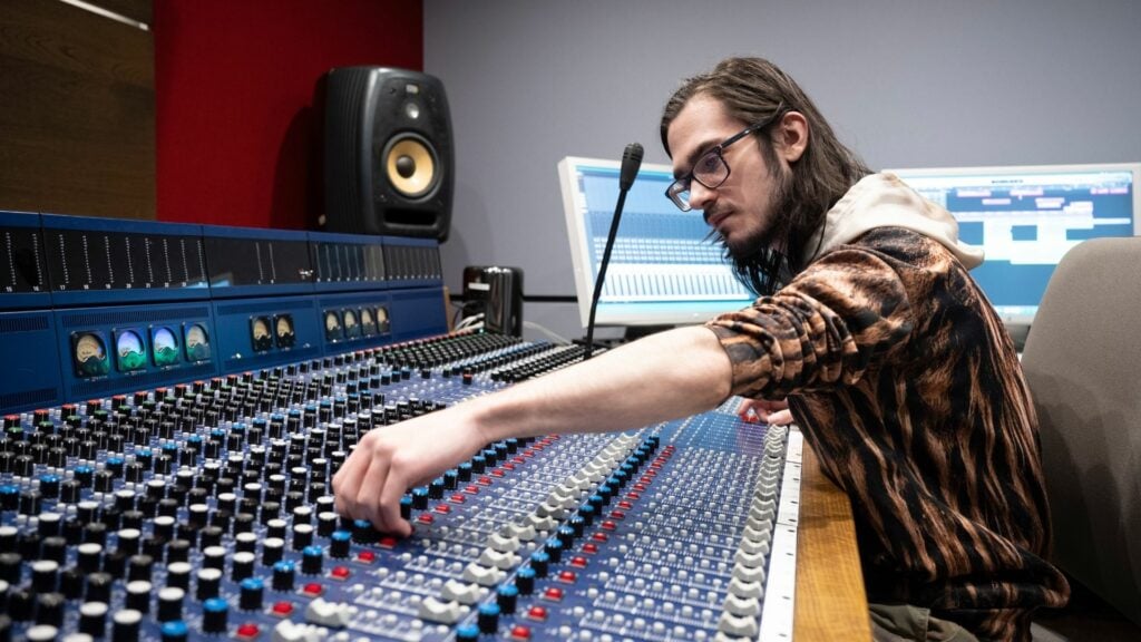Student working with the recording studio