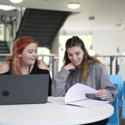 Two women working at a table