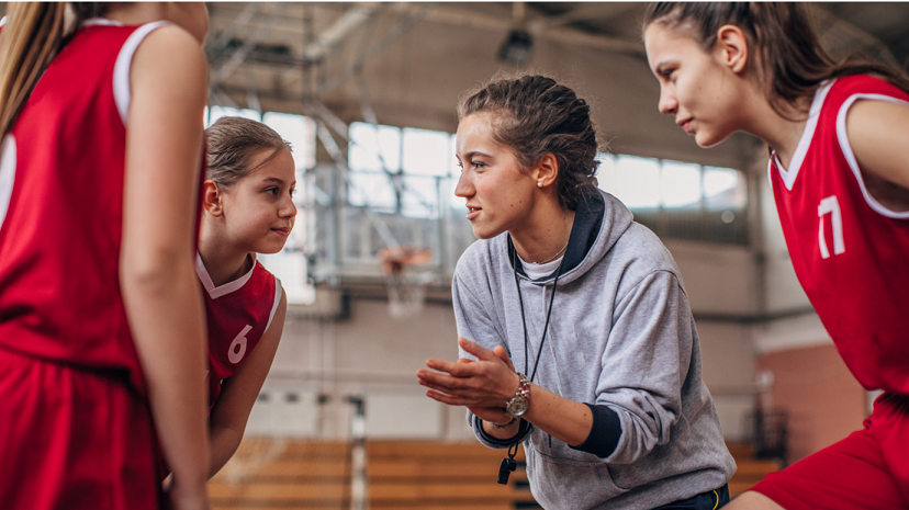 students in a sports huddle