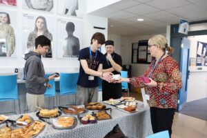 students fundraise by selling baked items for community week