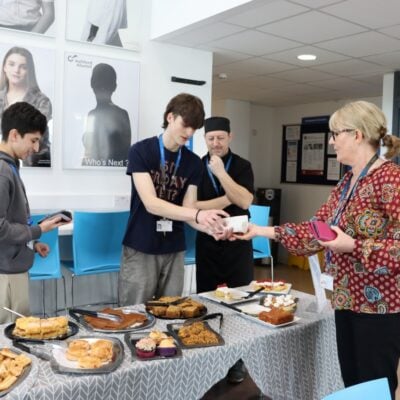students fundraise by selling baked items for community week