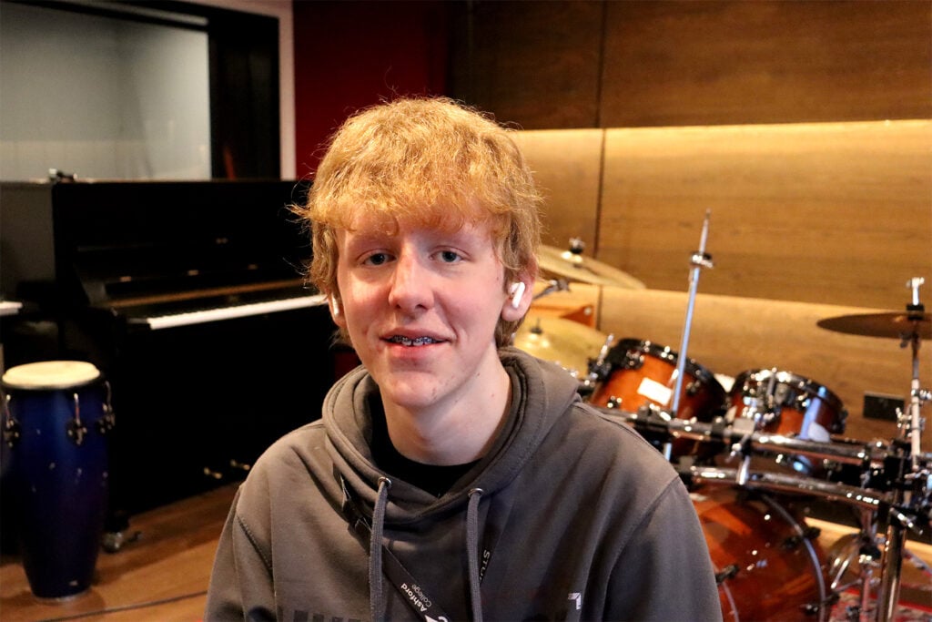 Student sat in a recording studio