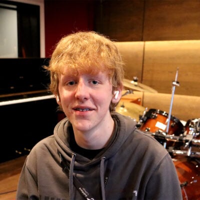 Student sat in a recording studio