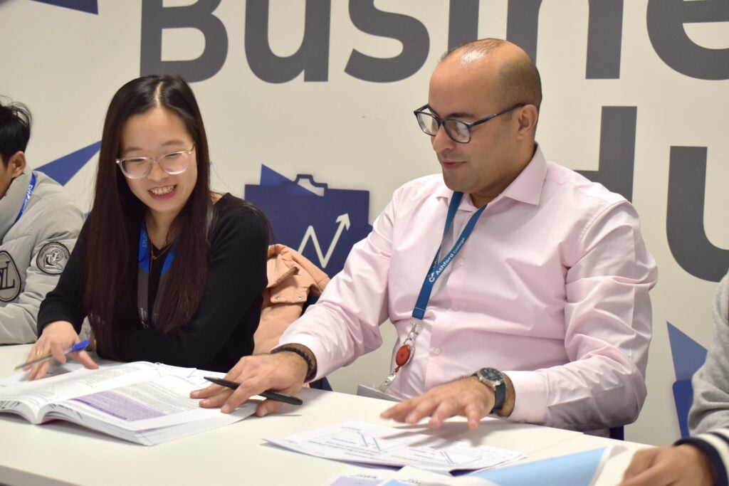 Student with tutor looking at work