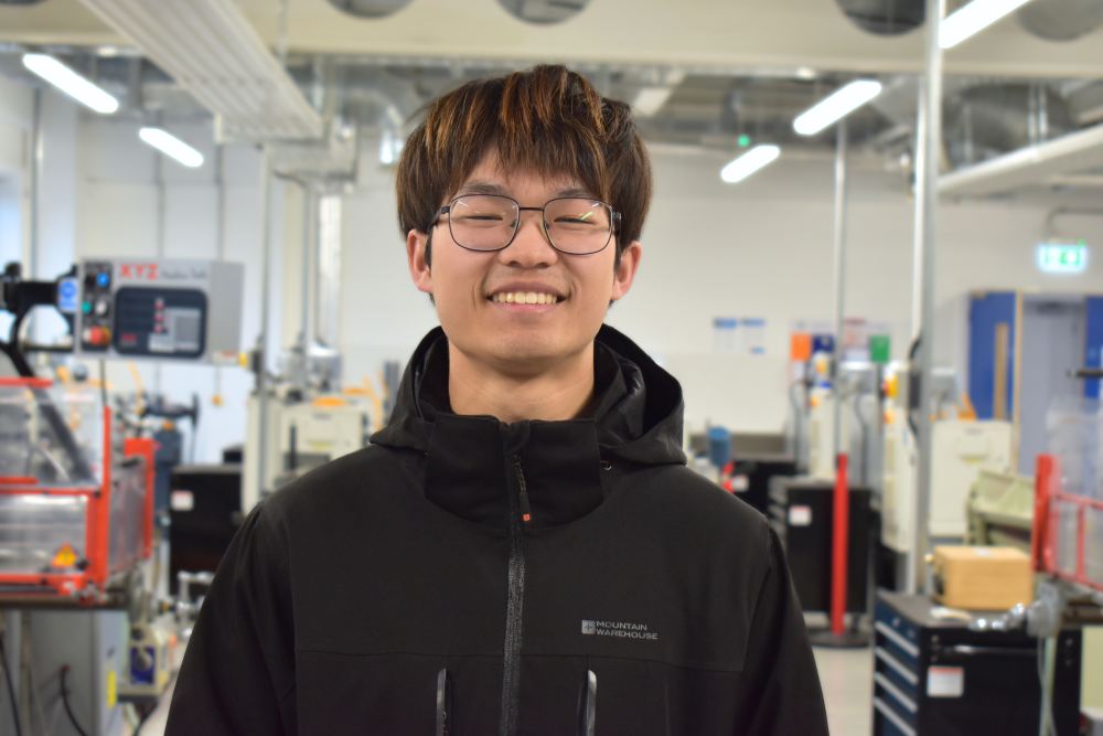 Student stood in engineering workshop