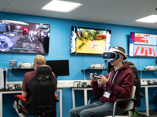 Students on consoles and VR in the Gaming Lab