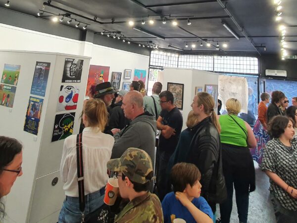 Guests looking at work at student exhibition