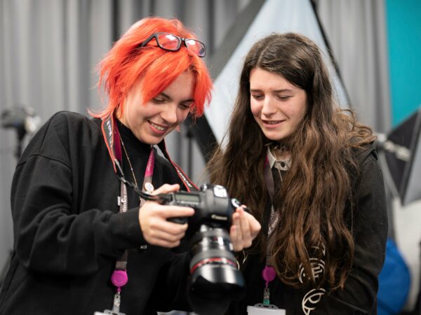 Students looking at a camera