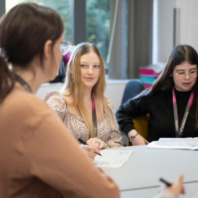 Students in a discussion with lecturer