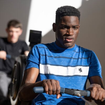 Sports student on the rowing machine