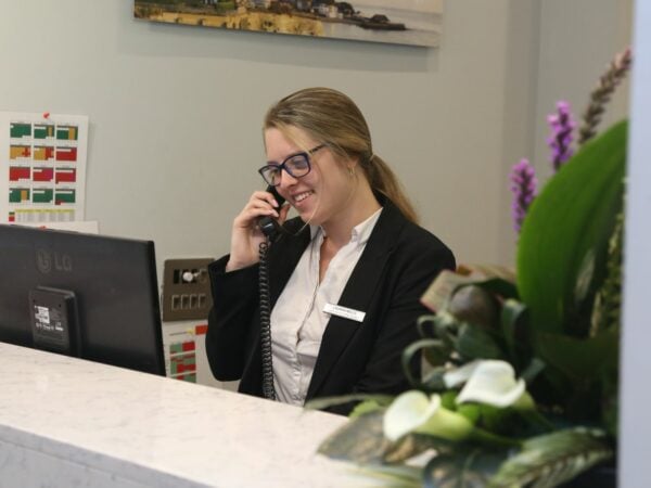 Business student working in hotel reception