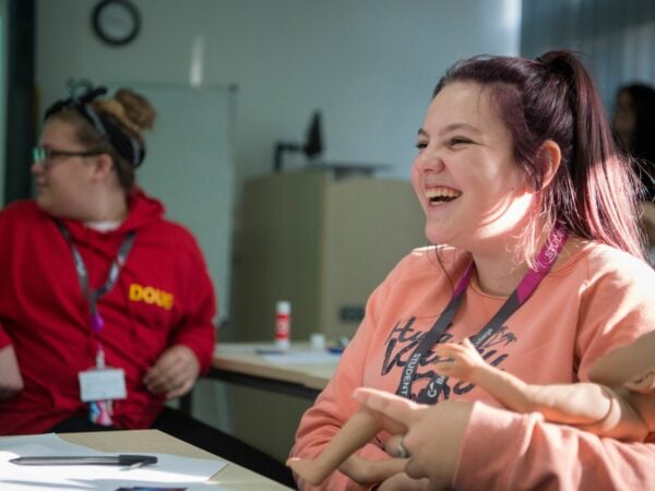 Early Years student smiling in lesson
