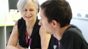 Staff member supporting student