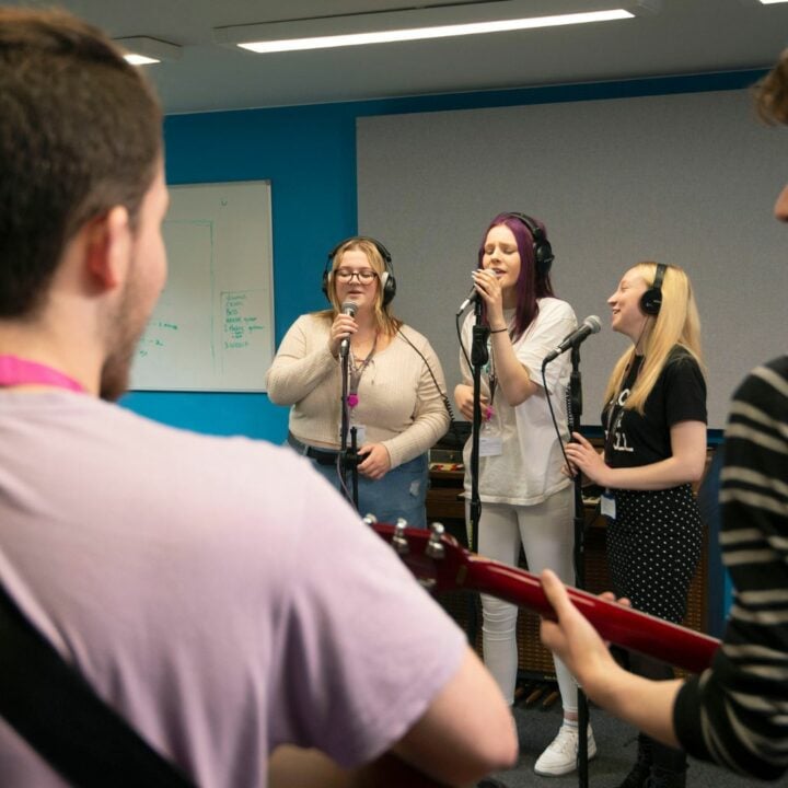 Music students performing in rehearsal room