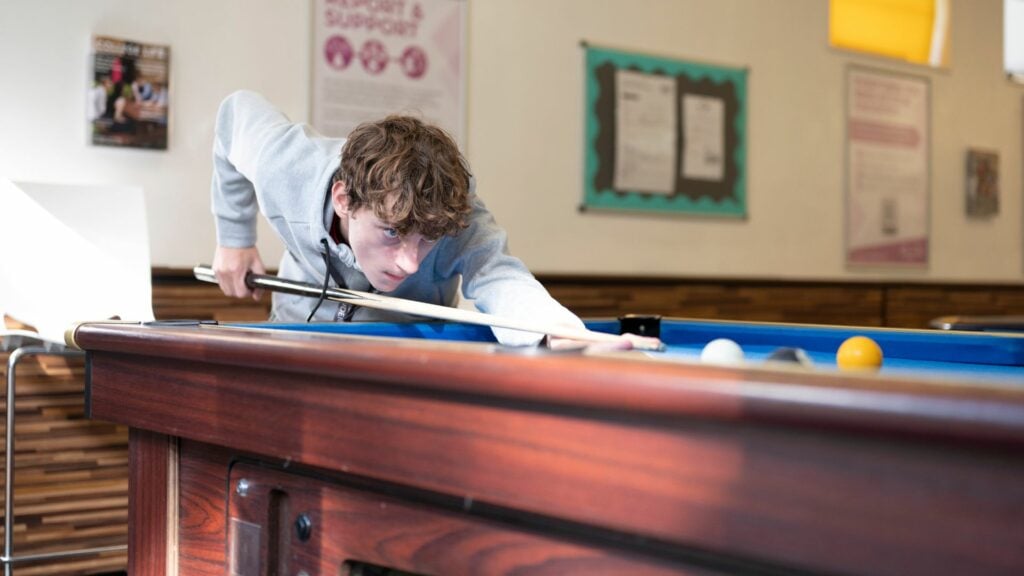 Student playing pool