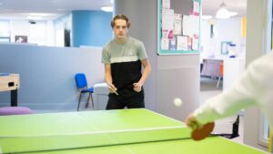 Students playing table tennis