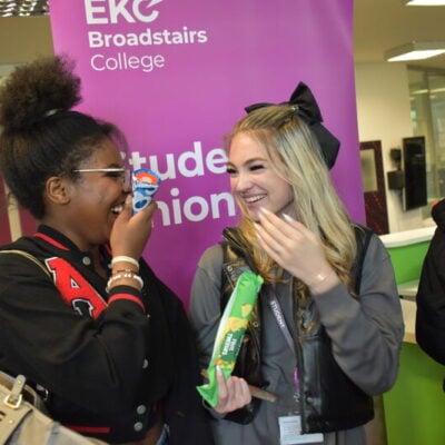 student's union students laugh together