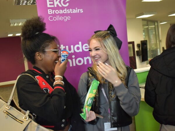 student's union students laugh together