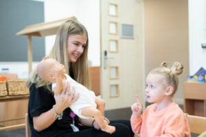 early years student with young girl
