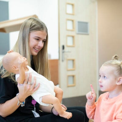 early years student with young girl