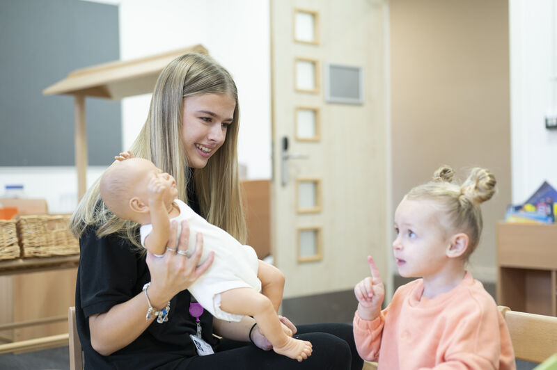 early years student with young girl