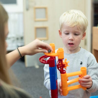 education and early years student interacting with toddler