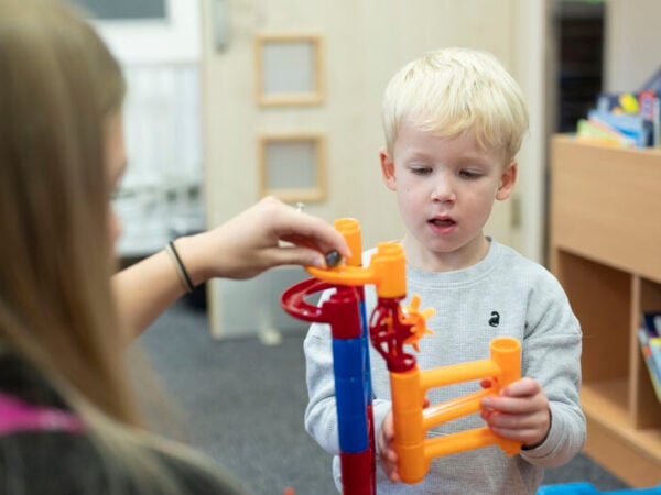 education and early years student interacting with toddler