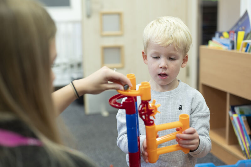 education and early years student interacting with toddler