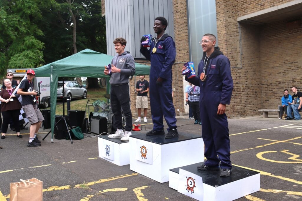 winners of the soapbox race stand on a podium