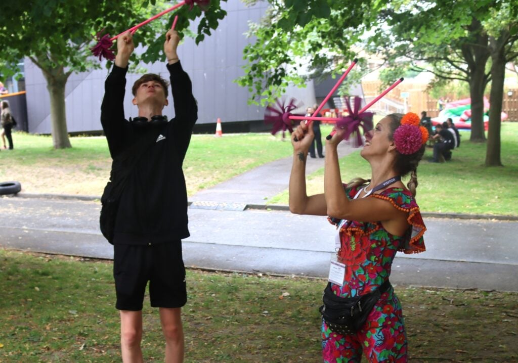 circus performer teaches skills to a student