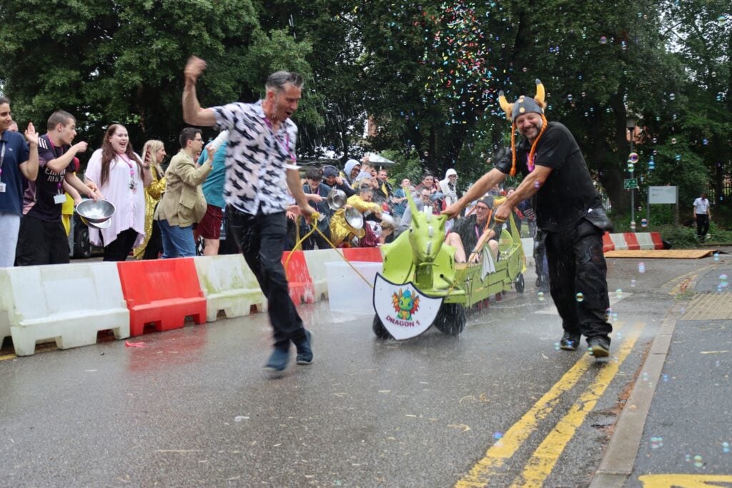 staff at the college race in a soapbox race