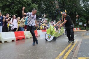 staff at the college race in a soapbox race