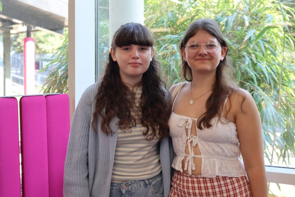 two female students pose for a camera on results day