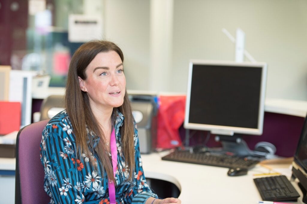 a staff member supporting Adult students