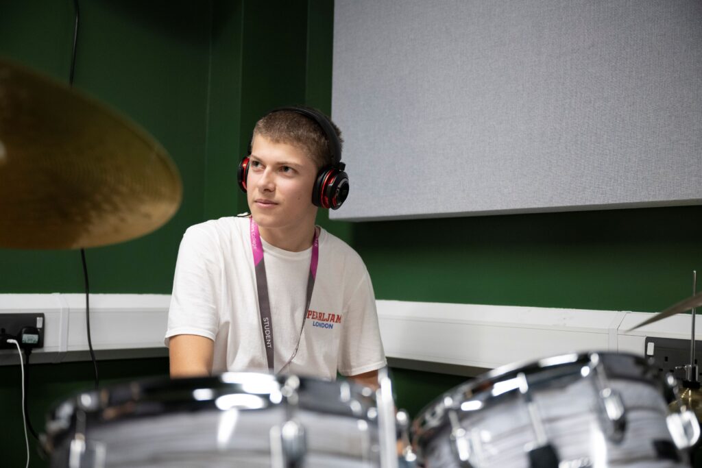 Student playing the drums