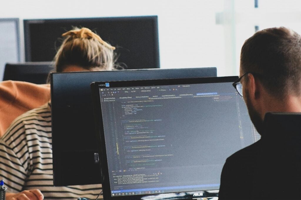 People coding on a computer