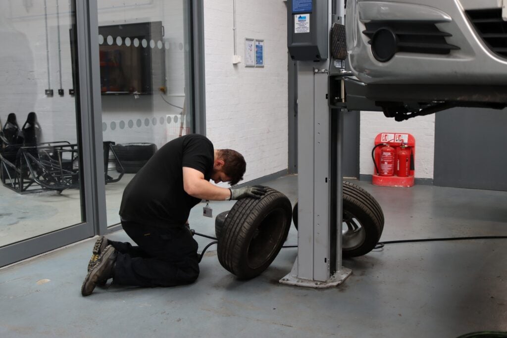Adult student works in Automotive workshop