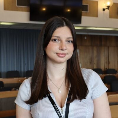 student smiling at the camera