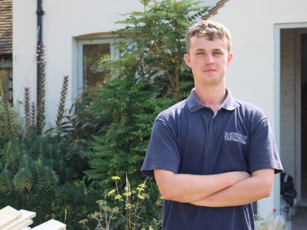 Apprenticeships student standing infront of his work placement