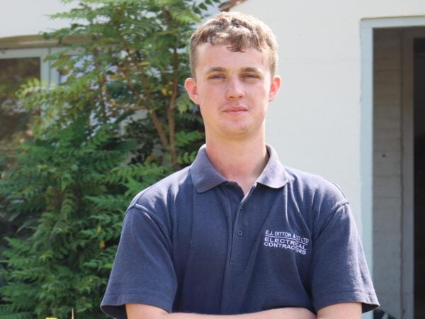 Apprenticeships student standing infront of his work placement