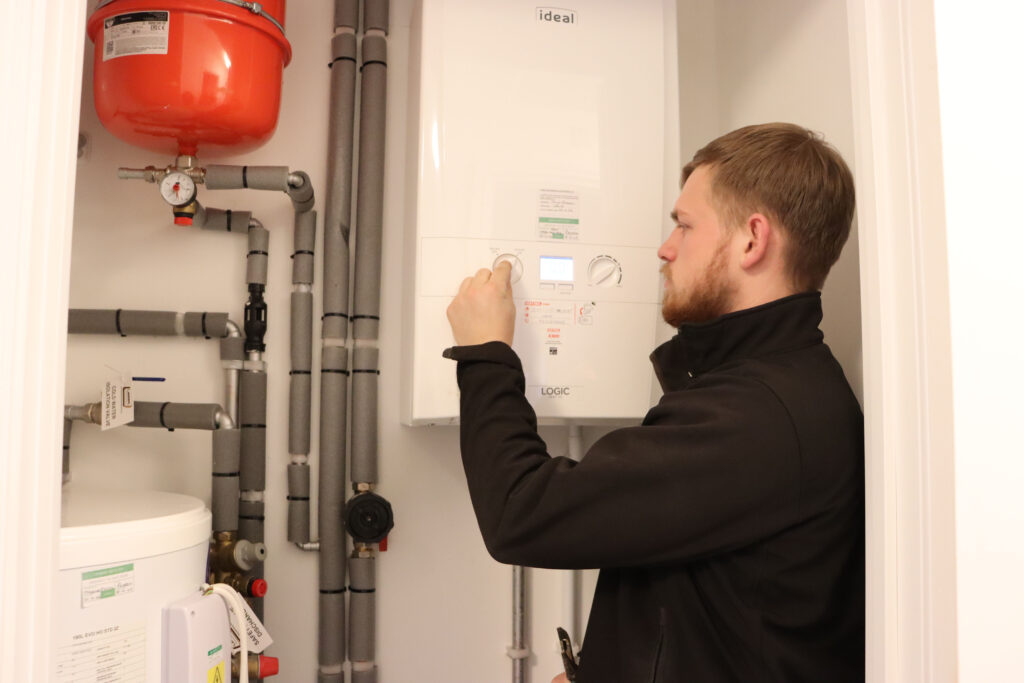Gas engineer working on a boiler