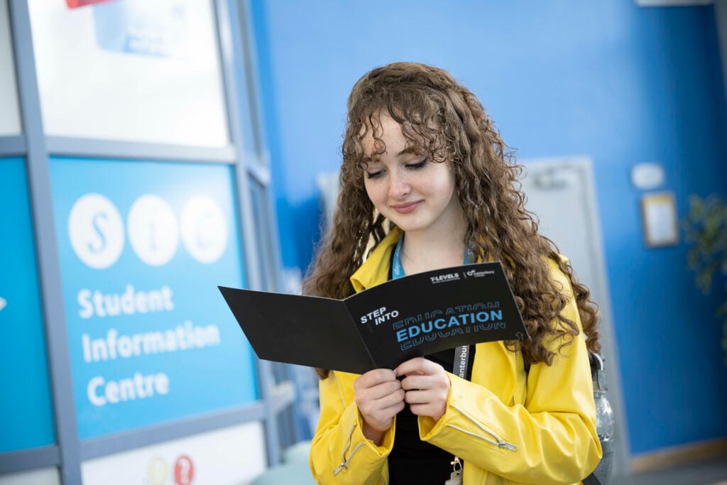 A levels student looking through a book
